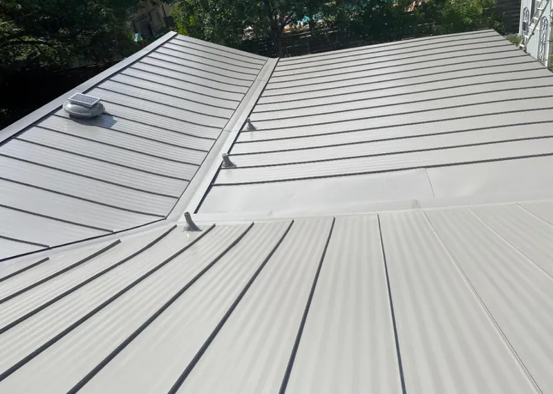 Solar attic fan installed on a metal roof for Roof Ventilation in Frenchtown